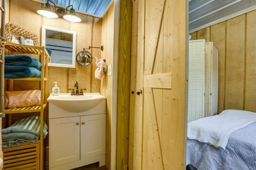 a small bathroom with a sink and a mirror at Pet-Friendly Gulf Coast Rental Near Keaton Beach! in Perry