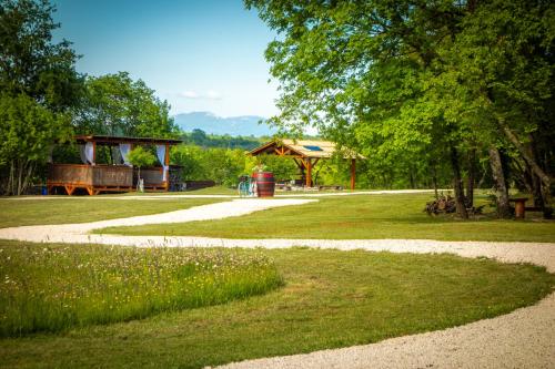 a park with a path and a pavilion in the distance at Camping Freedom Istria Pitches in Foli