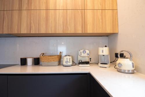 a kitchen counter with various appliances on a counter top at STALèA Luxury Villa in Pefki Rhodes