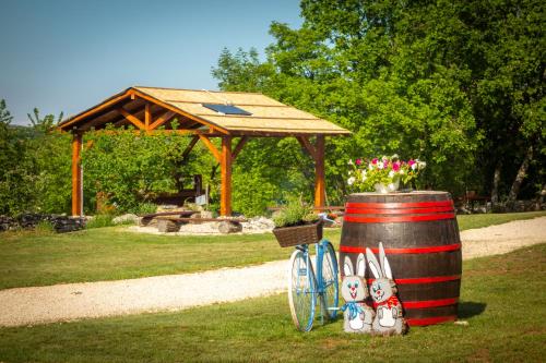 a barrel and a gazebo in a park at Camping Freedom Istria Pitches in Foli