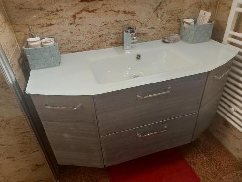a bathroom sink with a white counter top at Villa M & D in Sveti Filip i Jakov