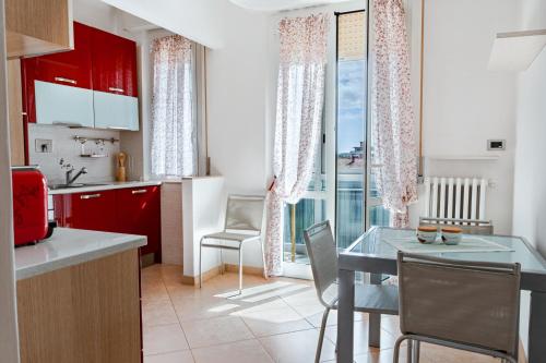a kitchen with a table and a dining room at Luxury House near train station in Livorno