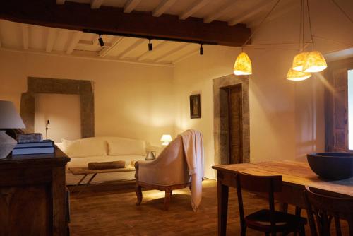 a living room with a couch and a table at SOLO PALACIO - Boutique Hotel & Spa in Llanuces
