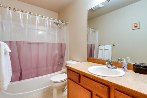 a bathroom with a sink and a toilet and a shower at Alaska Retreat with Balcony, Near Earthquake Park! in Anchorage