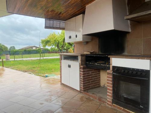 a kitchen with a stove and an oven at La Lagunilla Golf in Candeleda