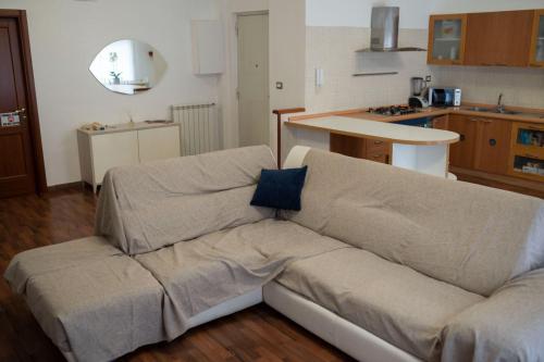 a living room with a couch in a kitchen at B&BSCICCHERI in Castellammare di Stabia
