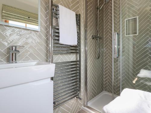a bathroom with a sink and a shower at Tresawle in Newquay