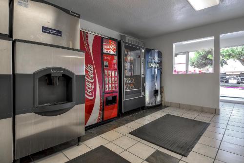 a room with two vending machines and a soda machine at Motel 6-Fontana, CA in Fontana