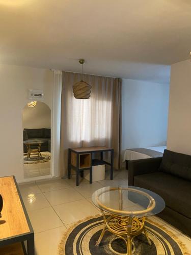a living room with a couch and a table at Kalia Beach Hotel Side in Side