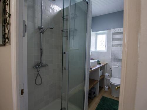 a bathroom with a glass shower with a sink and a toilet at Gîte Tocane-Saint-Apre, 4 pièces, 6 personnes - FR-1-616-314 in Tocane-Saint-Apre