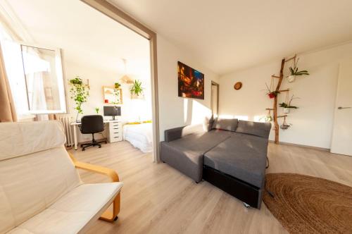 a bedroom with a black bed in a room at La Cuccia - Fully furnished apartment close to metro and Olympic venues in Châtillon