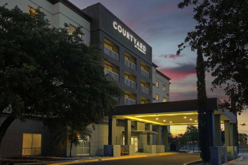 a hotel with a sign on the front of it at Courtyard Monterrey Airport in Monterrey