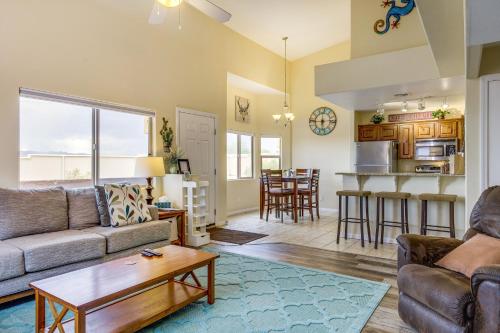 a living room with a couch and a table at Mesquite Vacation Rental with Pool Access! in Mesquite