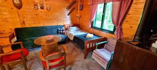 a living room with a couch and a table at Naša kuća-Veruša in Veruša