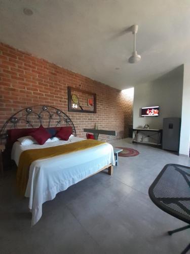 Ένα ή περισσότερα κρεβάτια σε δωμάτιο στο Loft con Jardín amplio 3