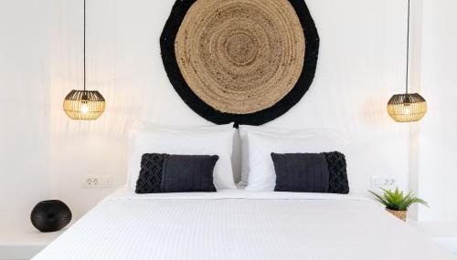 Un ou plusieurs lits dans un hébergement de l'établissement Maeva Suites Santorini