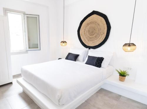 Un ou plusieurs lits dans un hébergement de l'établissement Maeva Suites Santorini