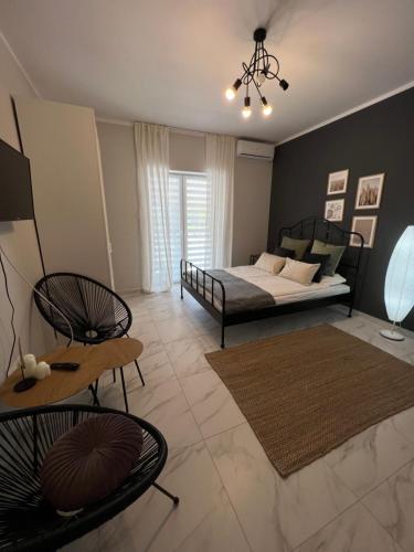 a bedroom with a bed and a table and chairs at Kierunek Górki in Górki