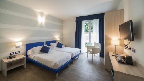 Katil atau katil-katil dalam bilik di Hotel Eden Garda