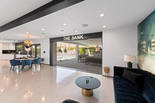 a living room with a couch and a table at THE BANK Mid-Century Luxury Resort Palm Springs in Palm Springs