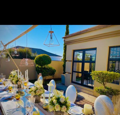 a table set up for a wedding with a view of the mountains at Olive Exclusive in Gaborone