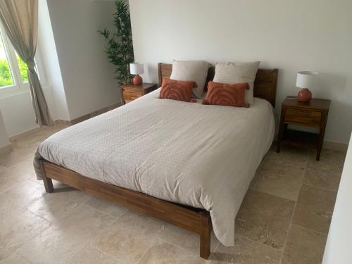 a bed with two pillows on it in a bedroom at Le mas des glycines in Salon-de-Provence