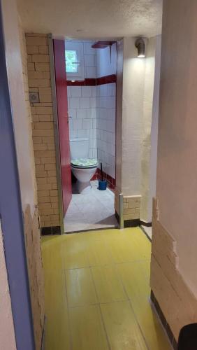an empty bathroom with a toilet in a room at Gîtes chez Daniel "Cevennes 3" in Mars