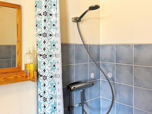 a shower in a bathroom with a shower head at Holiday home ORNÖ II in Dalarö