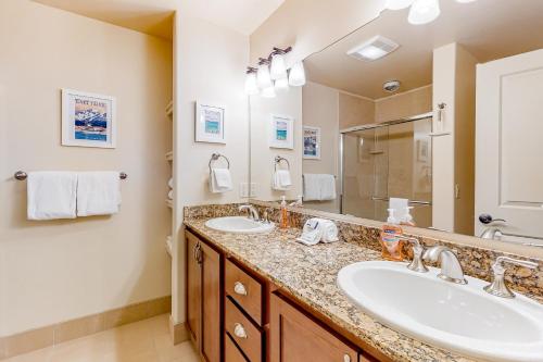 a bathroom with two sinks and a large mirror at Sweet Retreat at Sweet Water in Hailey