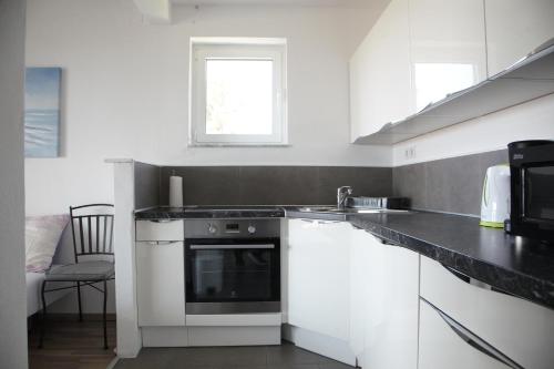 Kuchyň nebo kuchyňský kout v ubytování Apartments Sonne 2