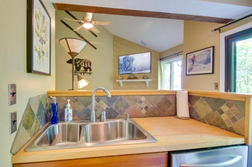 a kitchen with a sink and a counter at 2nd-Floor Condo with Community Pool Access! in Lyndhurst
