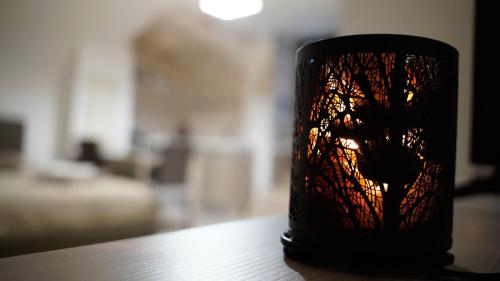a black cup sitting on top of a table at Il Segreto in Putignano