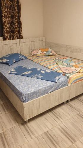 two beds sitting on the floor in a room at Casa Lucas si Rafael in 2 Mai