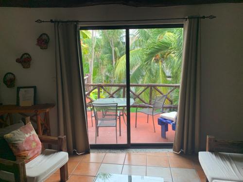 an open door to a patio with a table and chairs at Casa CARIBE Cancun in Cancún