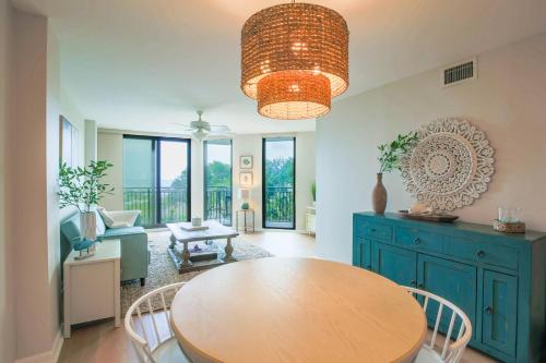 a dining room with a wooden table and chairs at Ocean Therapy in Isle of Palms