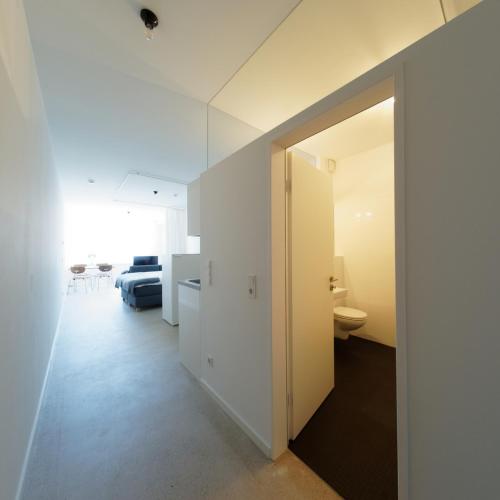 a room with a door leading to a bedroom at KAJO269 FERIENcc WOHNUNGEN IN DER ALTSTADT in Freiburg im Breisgau