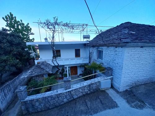 an aerial view of a house with a stone wall at Sokolli Guest House in Gjirokastër