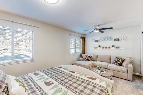 a bedroom with a bed and a couch at Tranquil Haven Retreat - DSTR1068 in Stateline
