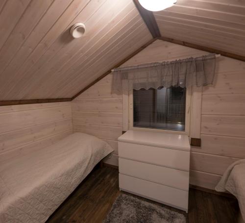Postel nebo postele na pokoji v ubytování Wellamo