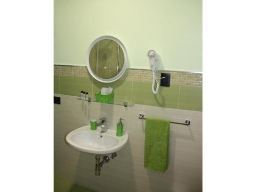 a bathroom with a sink and a mirror at Duomo Bed & Breakfast in Catania