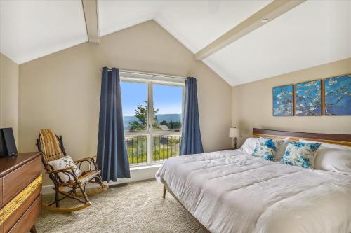 a bedroom with a large bed and a window at Trapp Hill View in Stowe