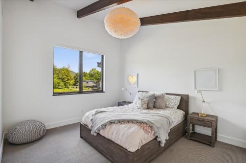 a bedroom with a bed and a window at Natures Way in Stowe