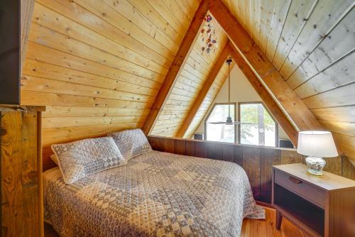 a bedroom with a bed and a wooden ceiling at Long Lake Cabin Rental with Private Dock! in Fountain