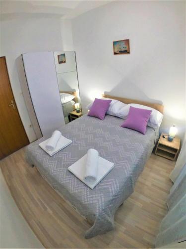 Ένα ή περισσότερα κρεβάτια σε δωμάτιο στο Apartman Tina