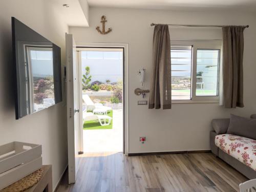 a bedroom with a bed and a view of the ocean at villa Dantès in Bari