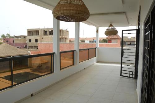a balcony with a view of a building at Keur Méry in Ngaparou