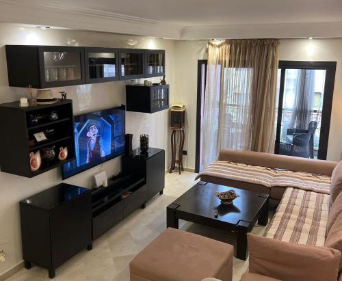 Appartment Jnane Atlasにあるテレビまたはエンターテインメントセンター