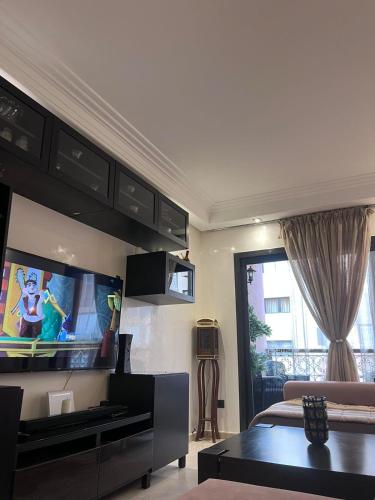 Appartment Jnane Atlasにあるテレビまたはエンターテインメントセンター