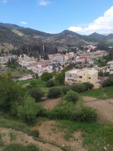a view of a city from a hill at Ketama trikital in Tlata Ketama