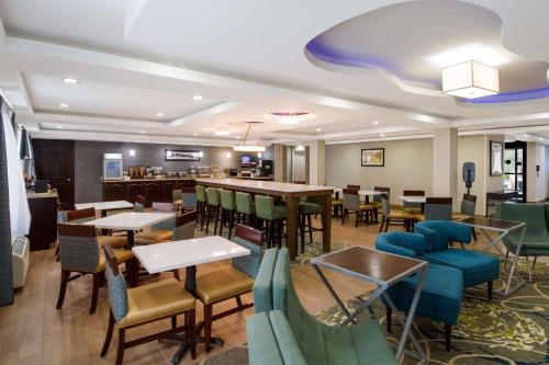 a restaurant with tables and chairs and a dining room at Milford Inn in Milford